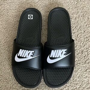 Men’s black Nike slides. White logo/swoosh. Benassi Just Do It. NIB Non-smoking.